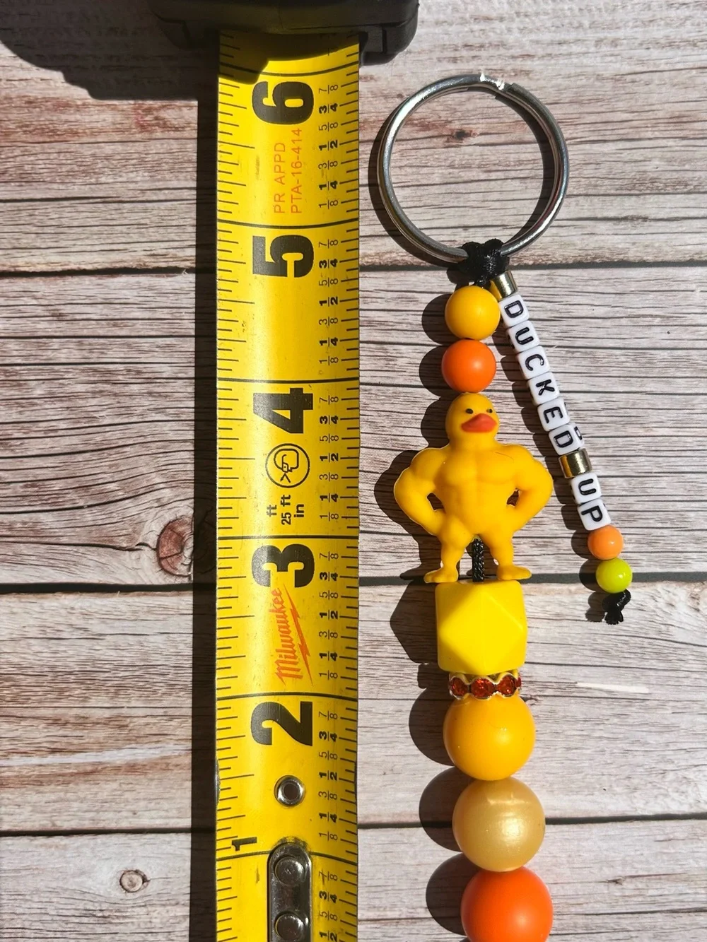 Yellow Muscular Rubber Duck Keychain with handmade letter bead strand